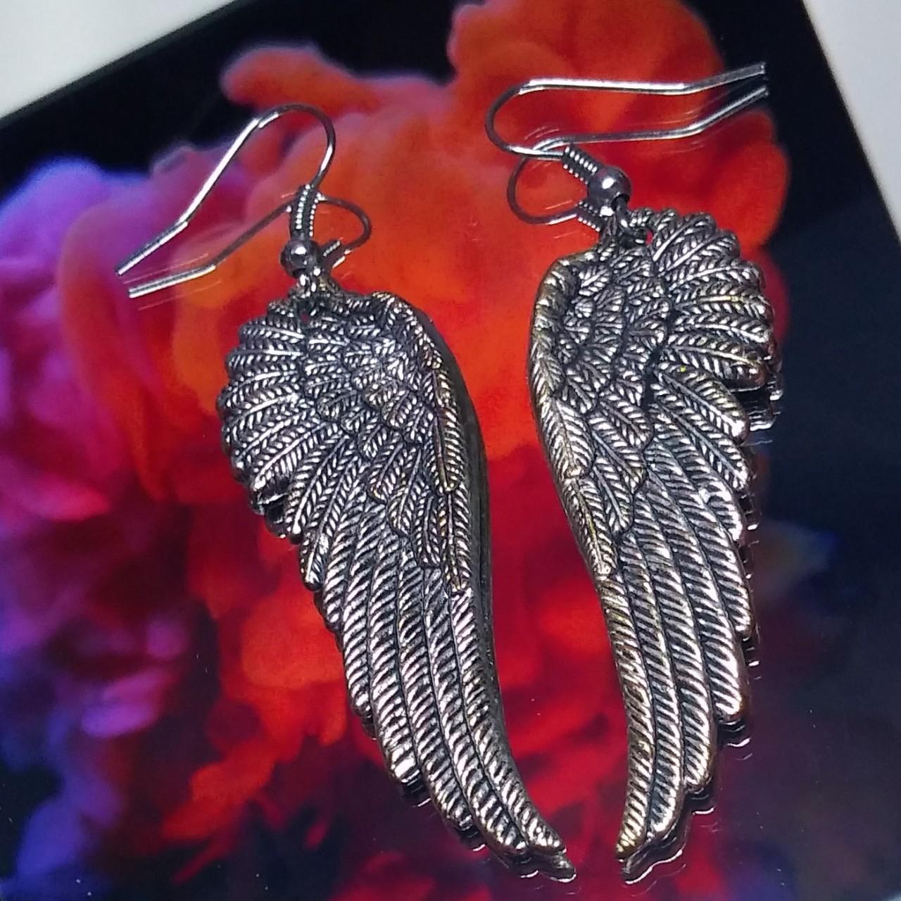 Adorable y2k wing earrings Lmk if you have any... Depop