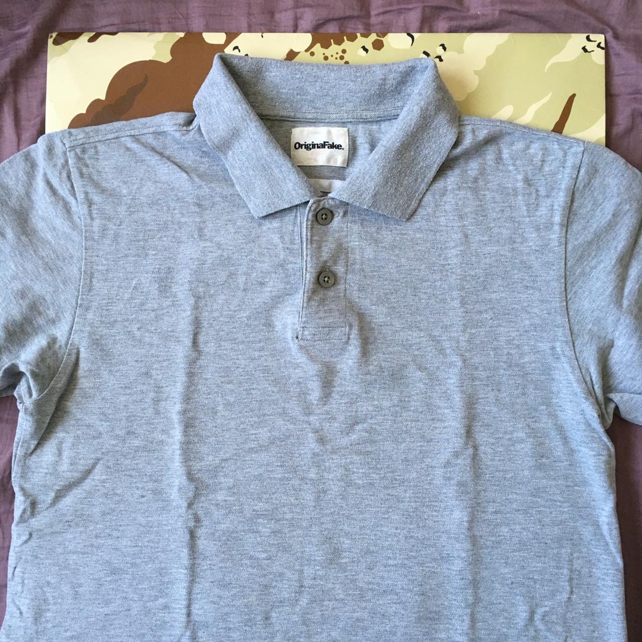 Originalfake KAWS Polo Shirt. Worn but still in a... - Depop