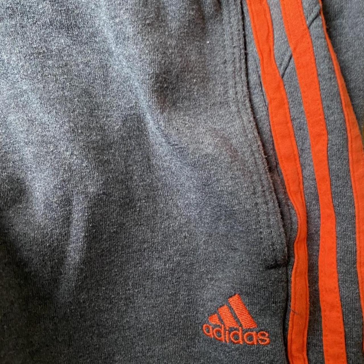 grey and orange adidas tracksuit