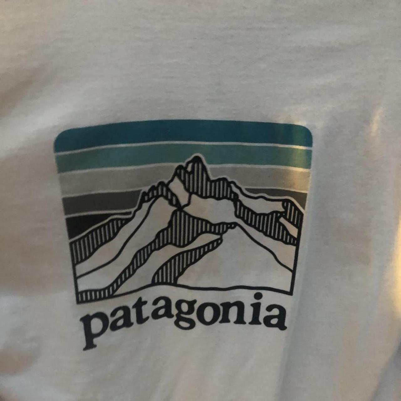 White Patagonia Long sleeve with Design on... - Depop