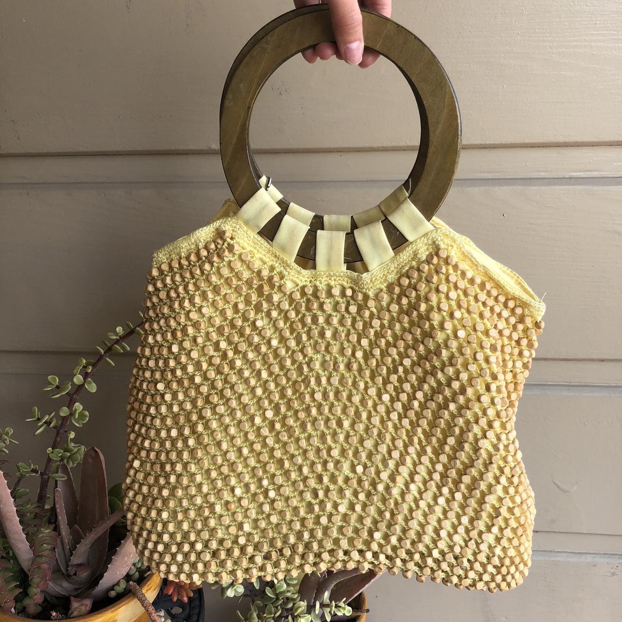 The Sak Original pastel yellow wood beaded purse