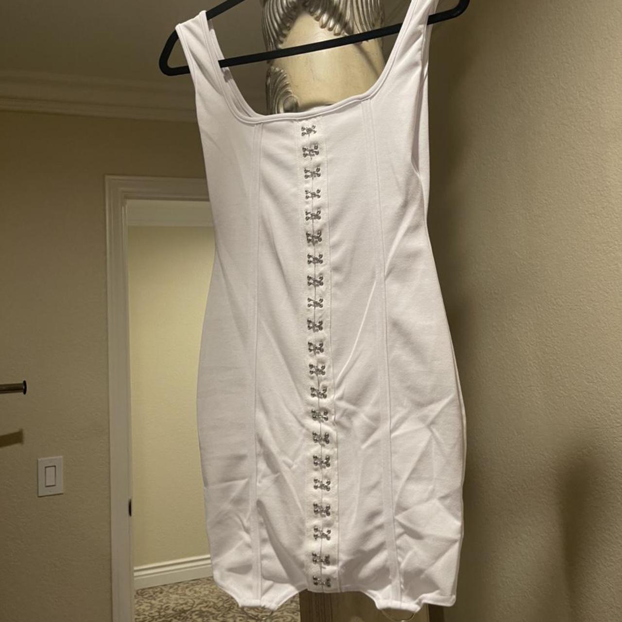 Cute little white mini dress with buttons going down... - Depop