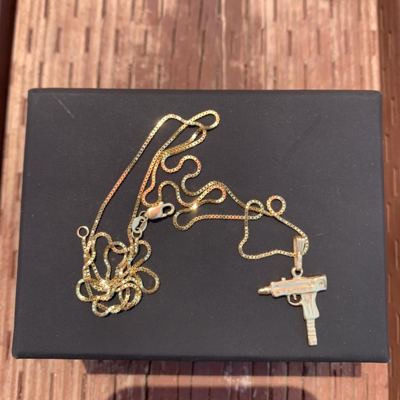 Supreme Gold Uzi Chain Gently used. From a | Depop