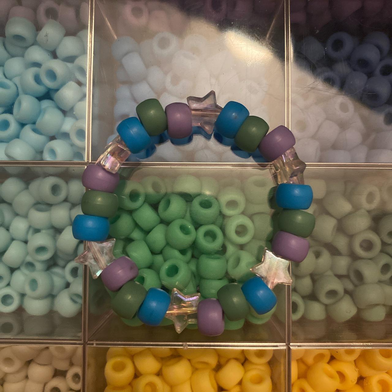 Handmade kandi bracelet with pink shimmery stars.... Depop