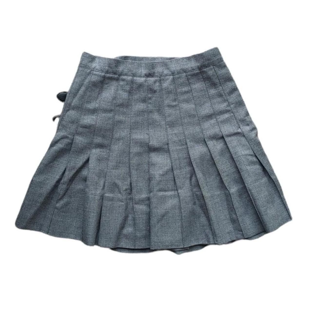 Pleated mini skirt with hip buckles. Featuring... - Depop