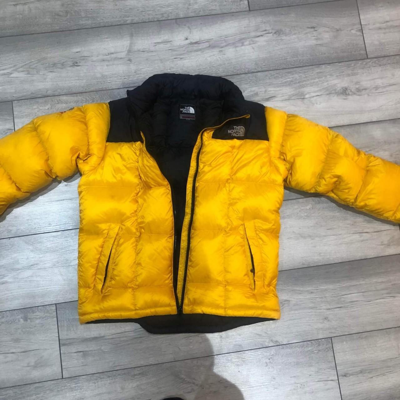 north face yellow and black puffer