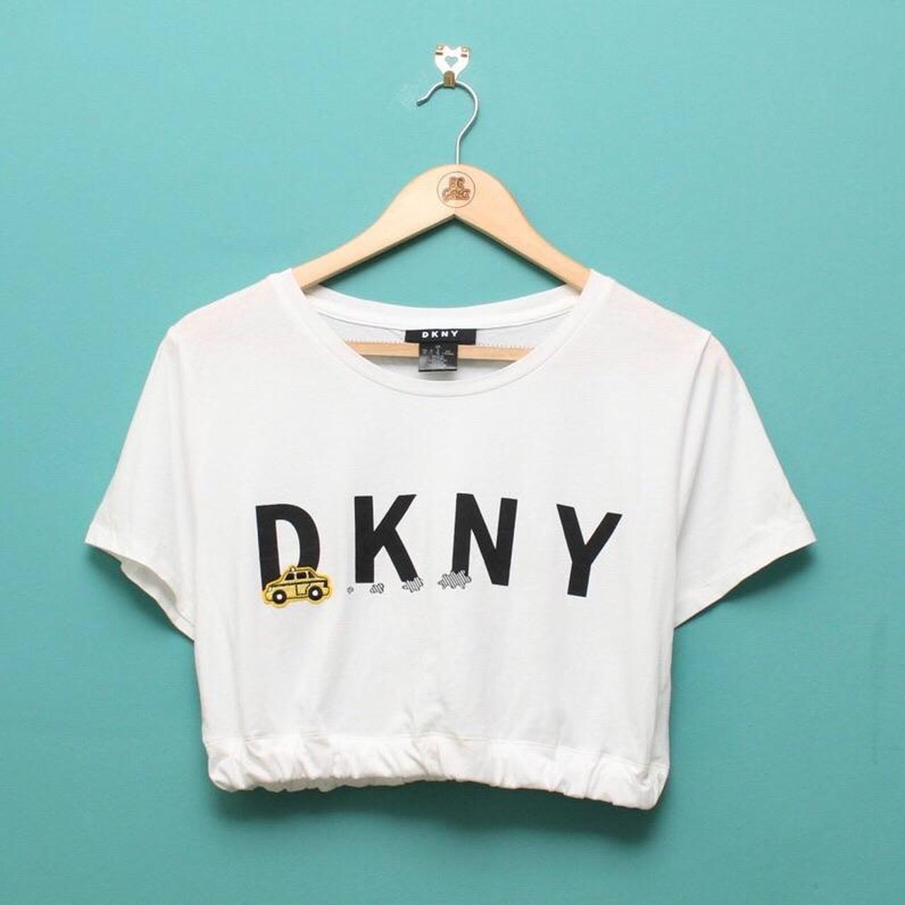 White DKNY crop top. Black print, embroidered/ patch... - Depop