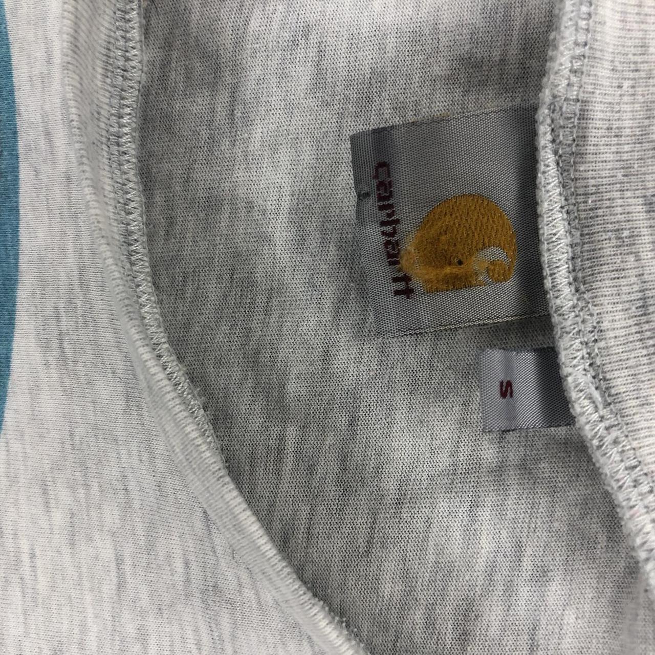 Carhartt t-shirt 2 very small holes and marks the... - Depop