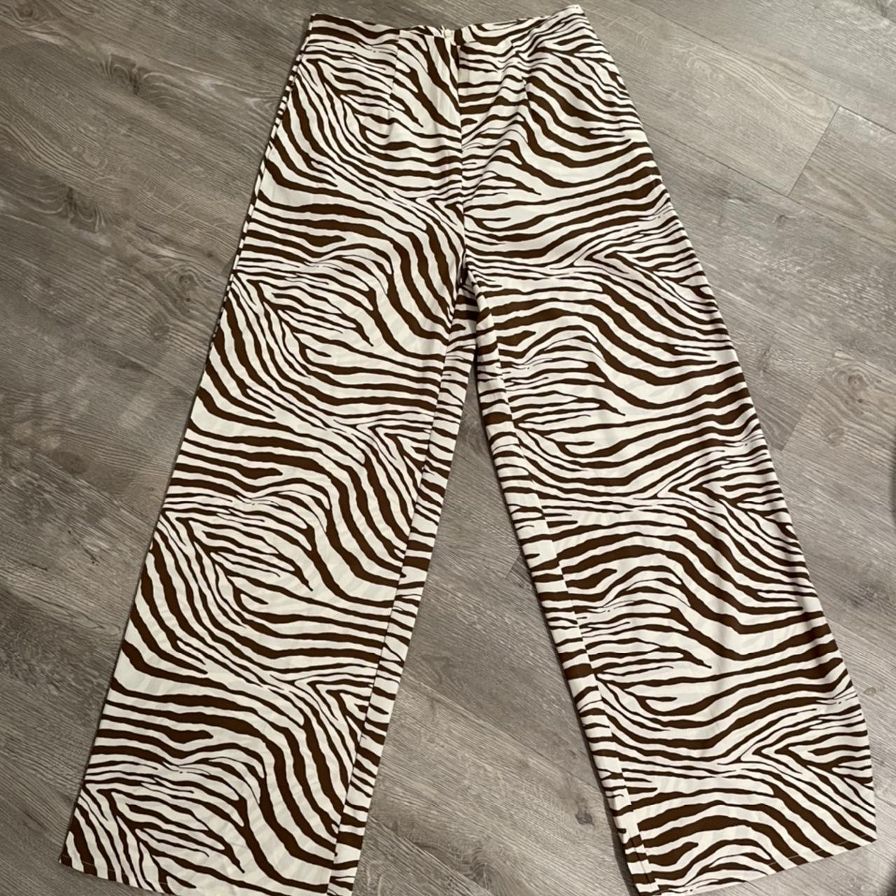 Cute brown zebra pants, size 10 #zebra #bottoms... - Depop