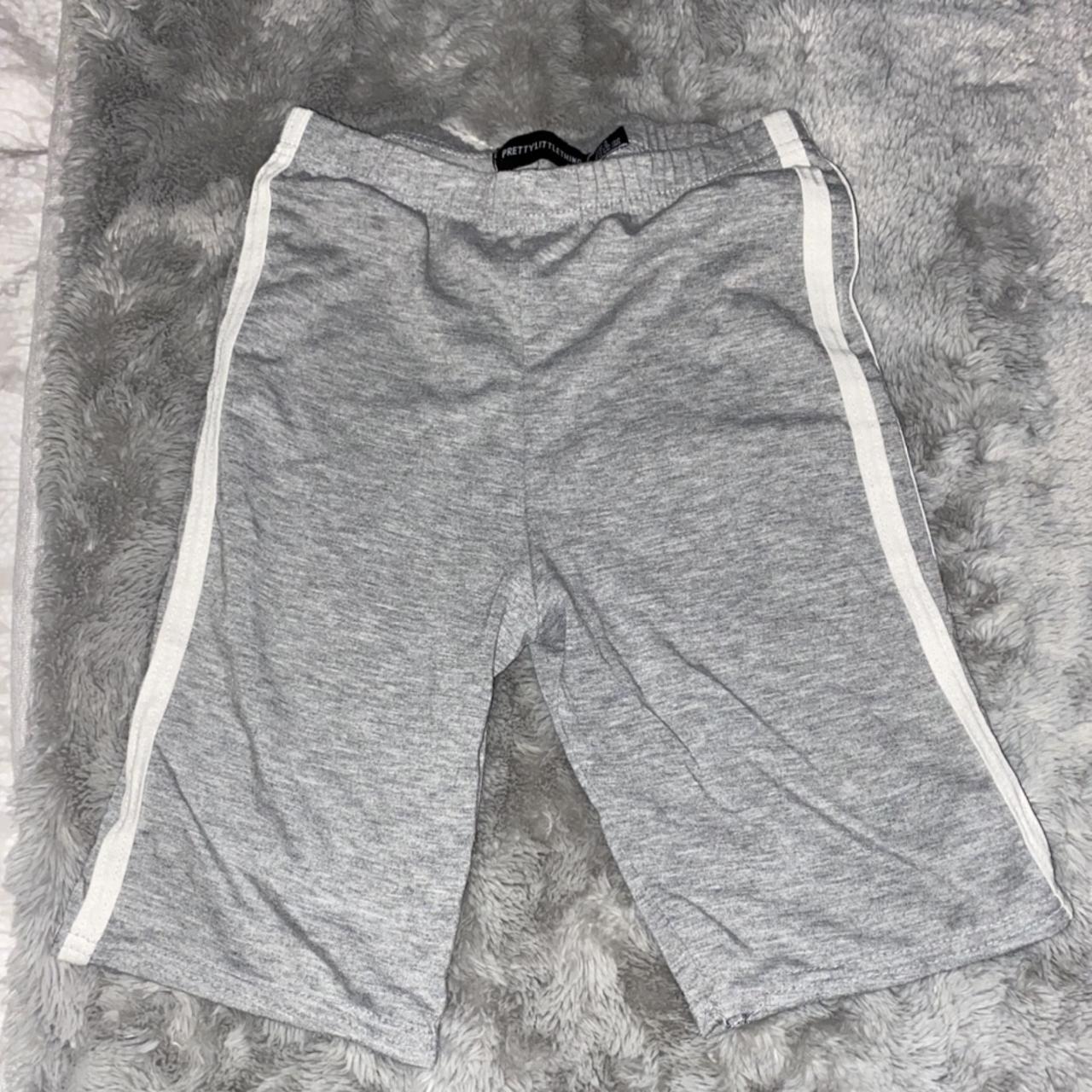 Prettylittlething cycling shorts with side stripe in - Depop