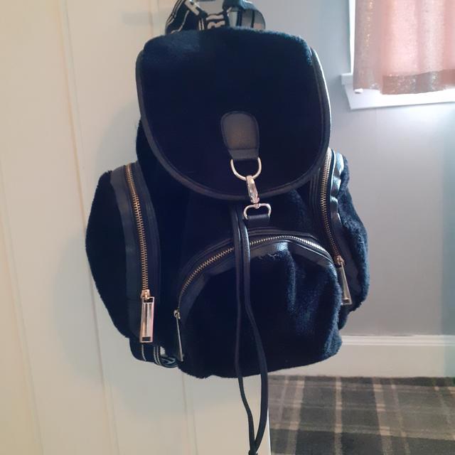 Black faux fur Rihanna river island backpack bag