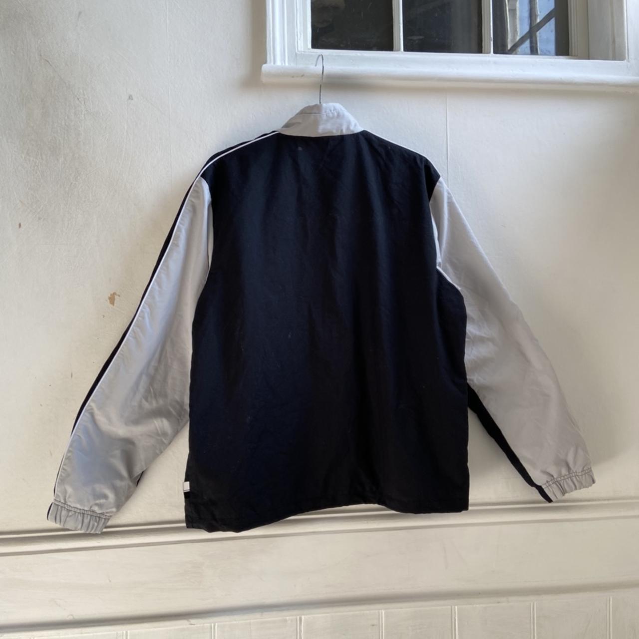 Vintage Nike track jacket in black/light grey -... - Depop