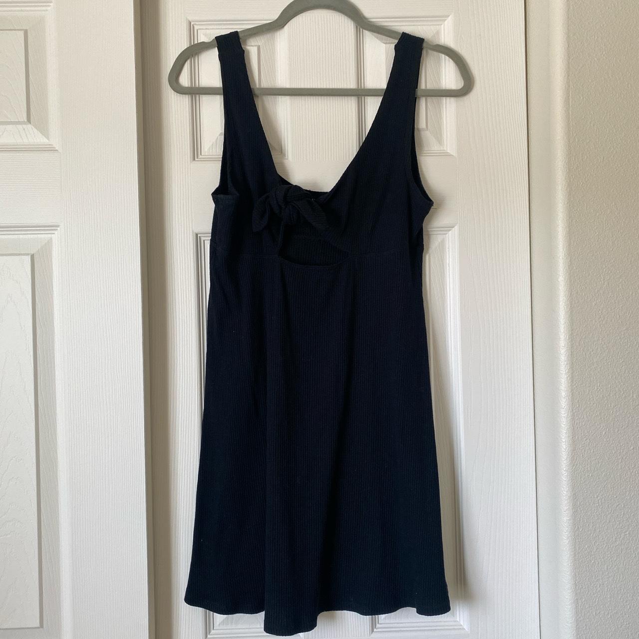 Billabong black ribbed mini dress with tie in front.... - Depop