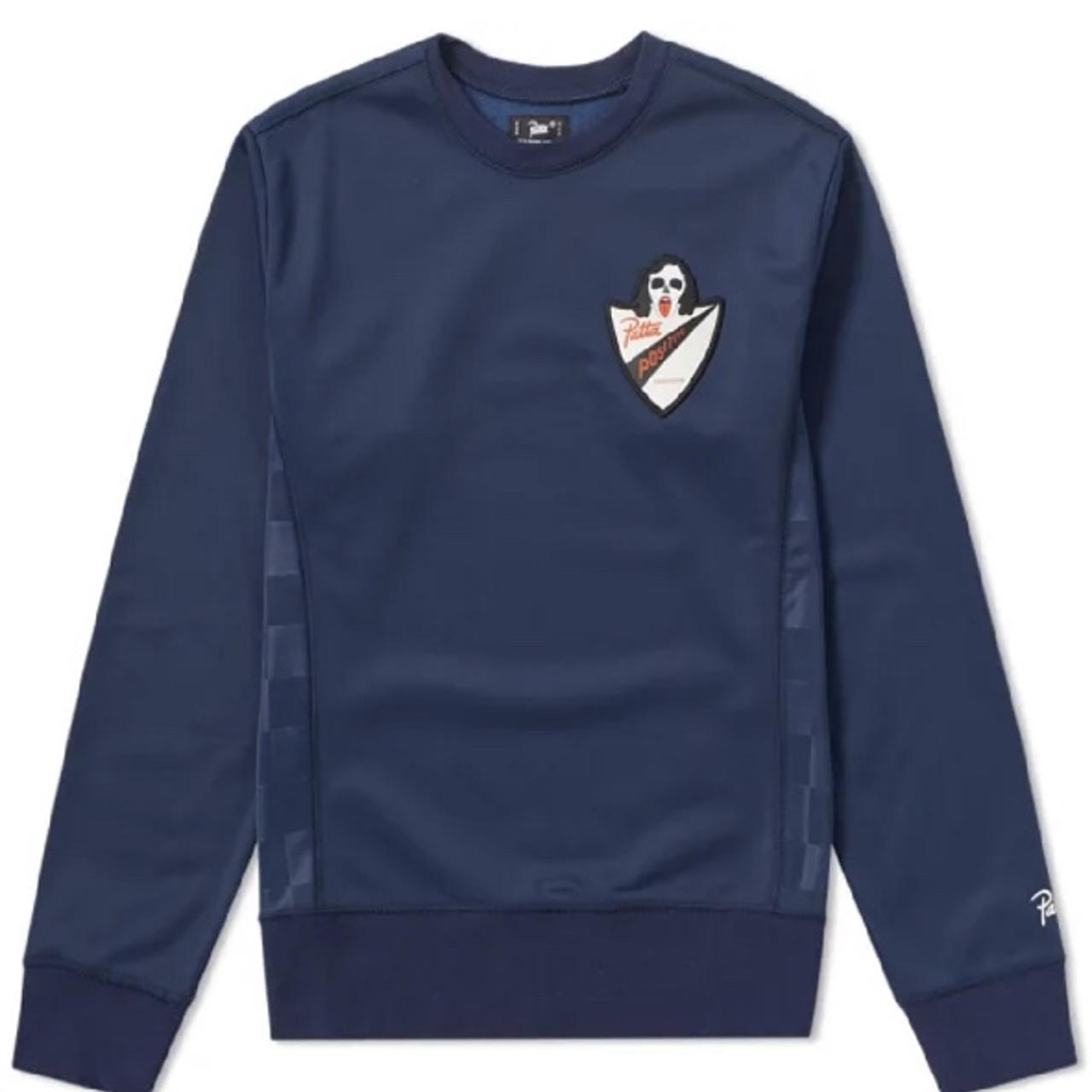 Dressed in navy with Patta's 'Positive Depop