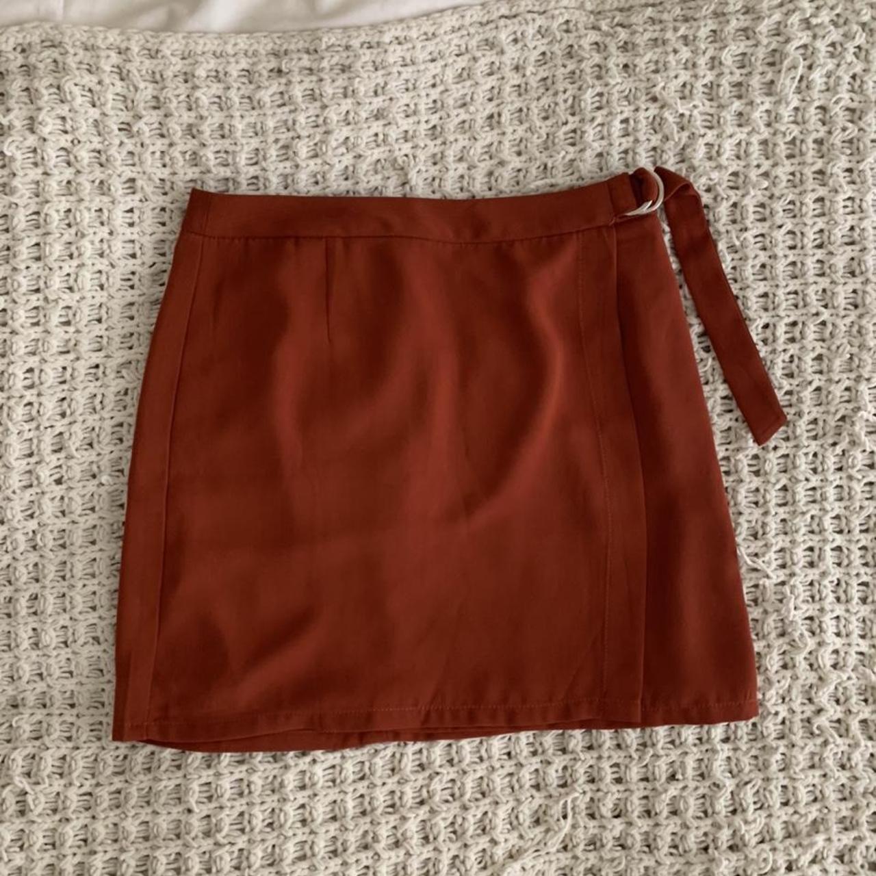 Silk mini skirt. Super cute tie on the side. Size... - Depop