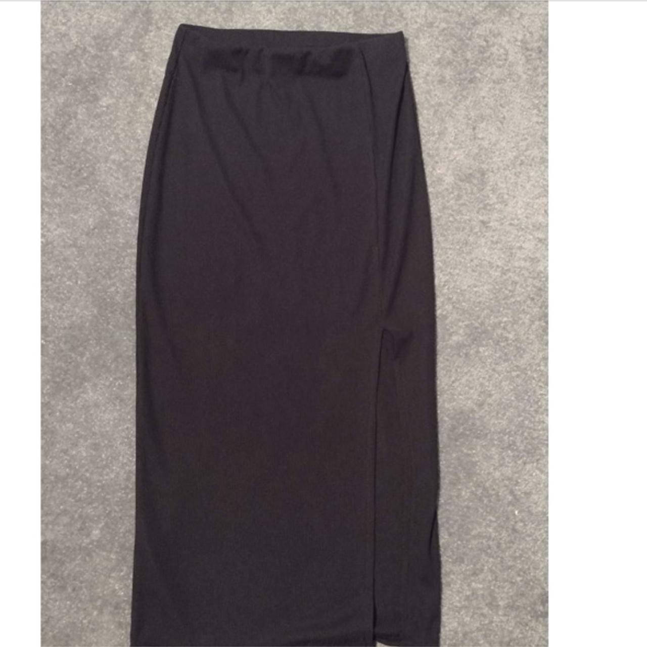 Black long skirt with a slit at bottom. Never worn... - Depop