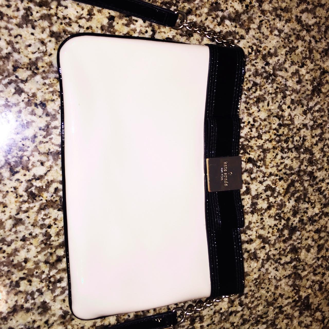 Kate spade black and white bow purse. The bag has a... Depop