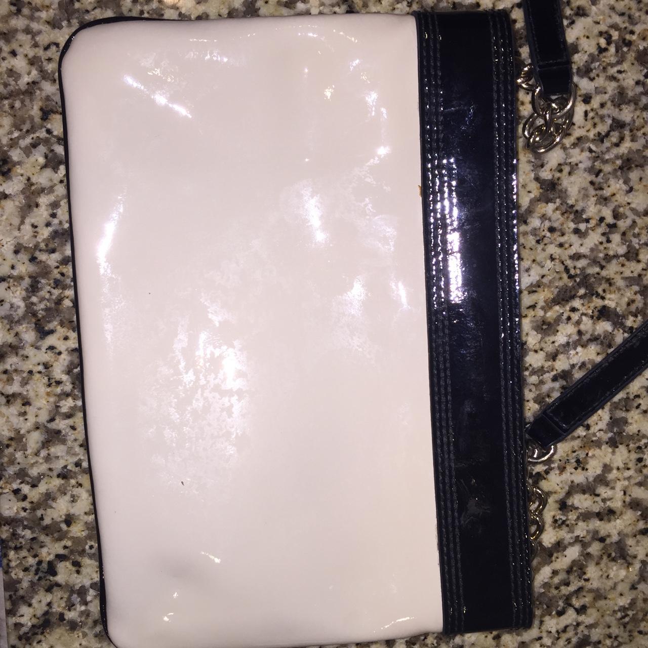 Kate spade black and white bow purse. The bag has a... Depop