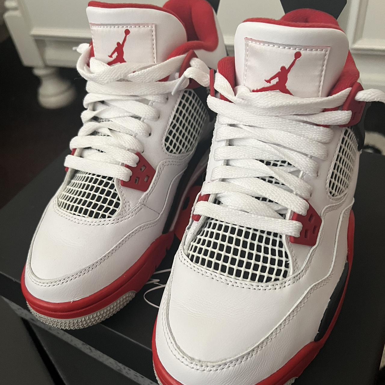 These are the Fire Red 4s in a 6.5 GS, worn a little... - Depop