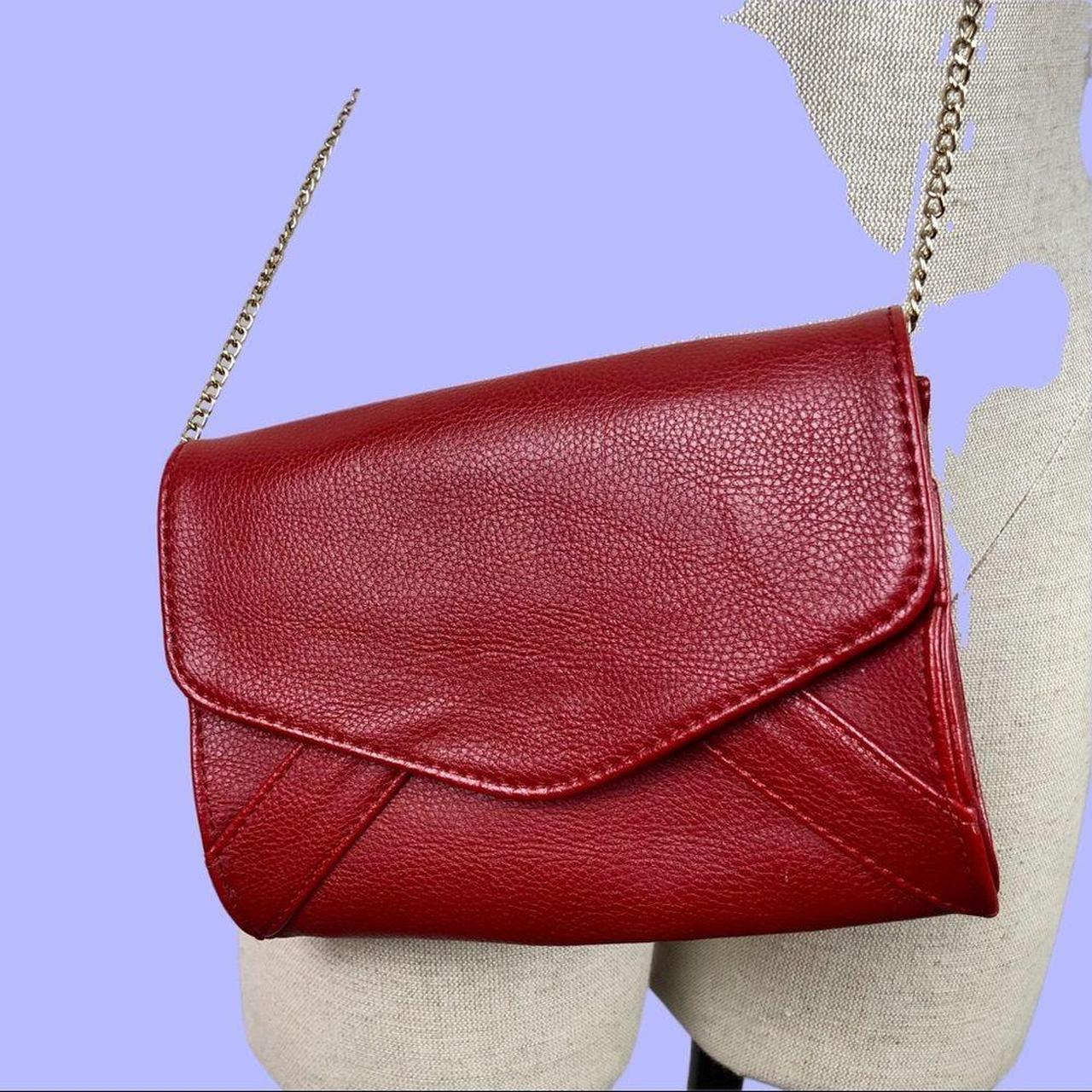This cute red crossbody purse is preowned, but... Depop
