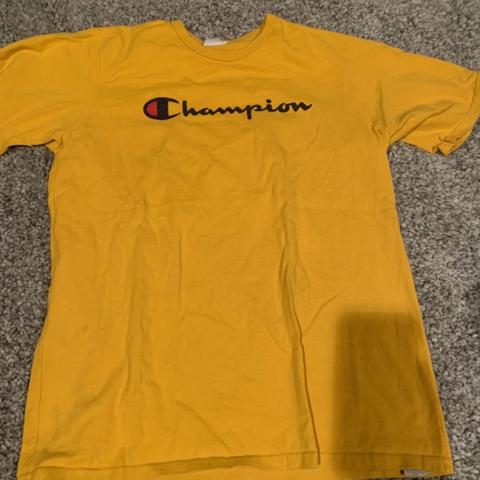 yellow and black champion shirt