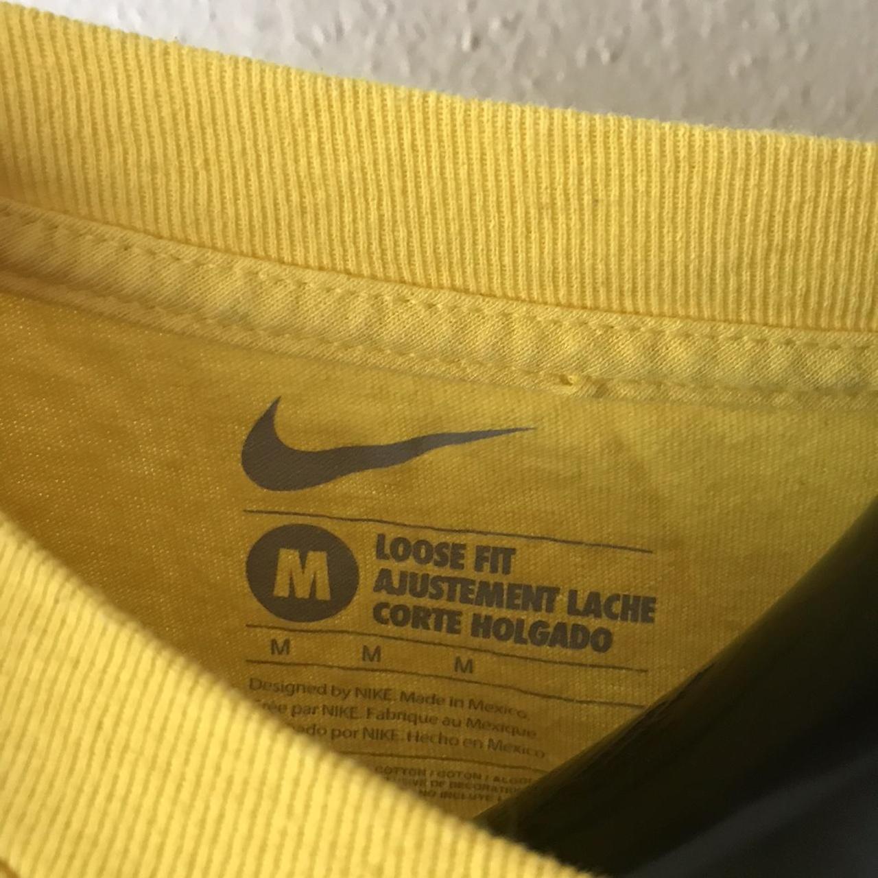 nike shirt yellow graphic like 90s early 00s logo... - Depop