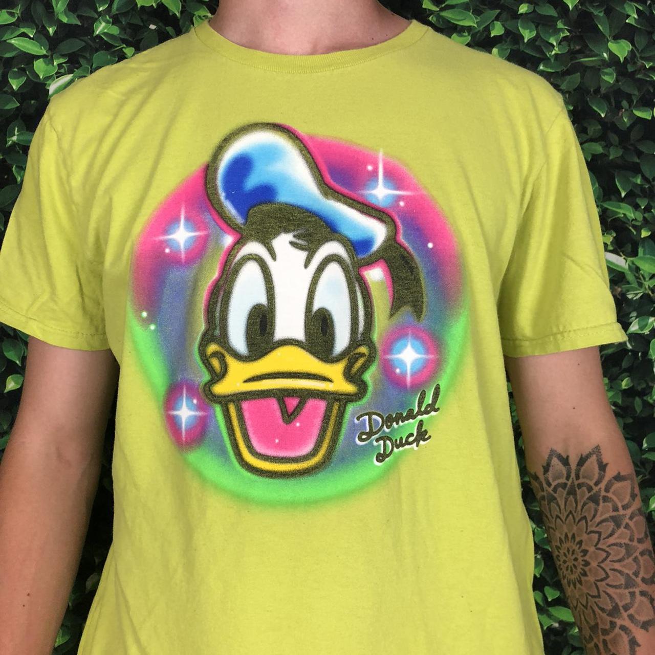 Neon Donald Duck Disney air sprayed graphic tee... - Depop