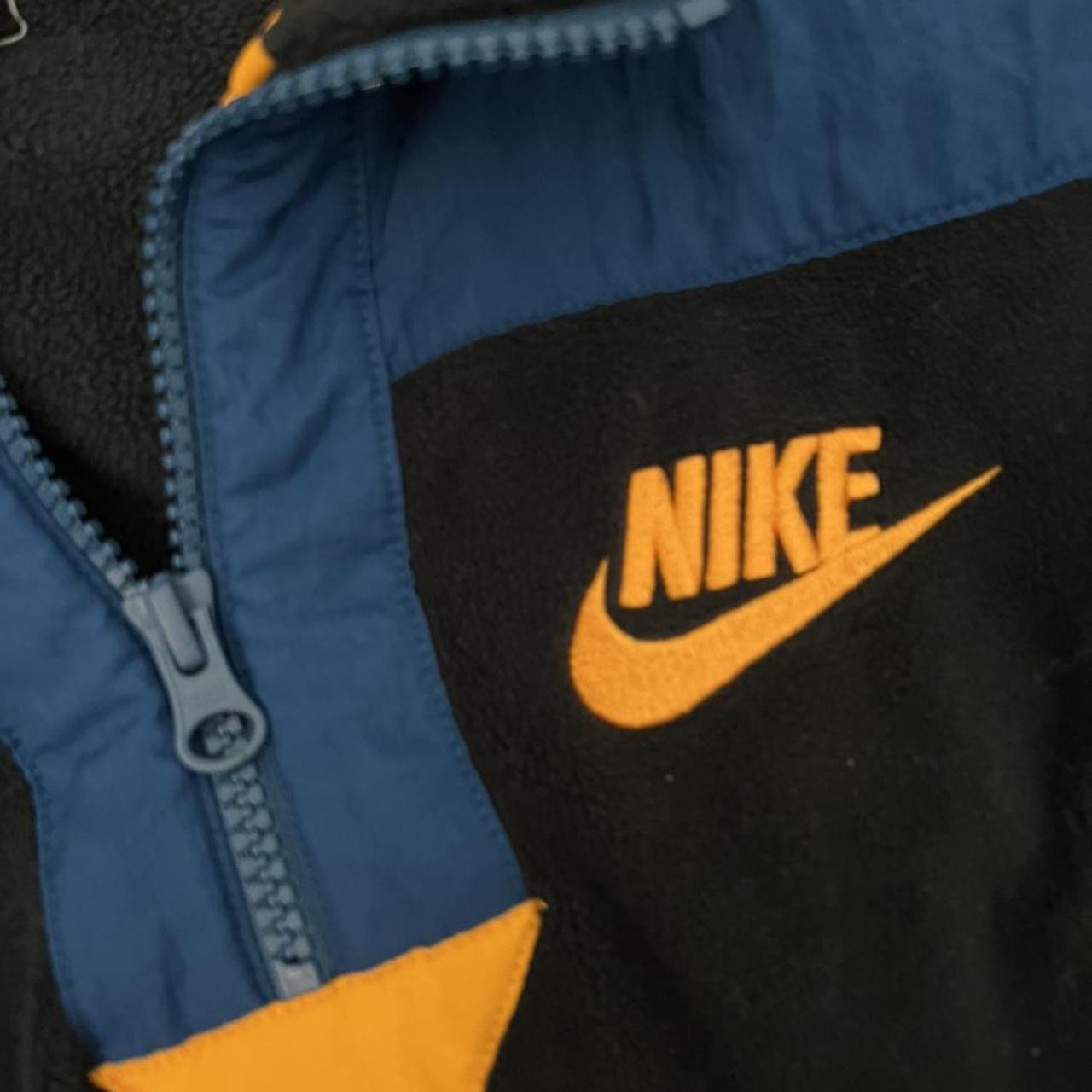 Nike black orange blue crew neck zip up large... Depop