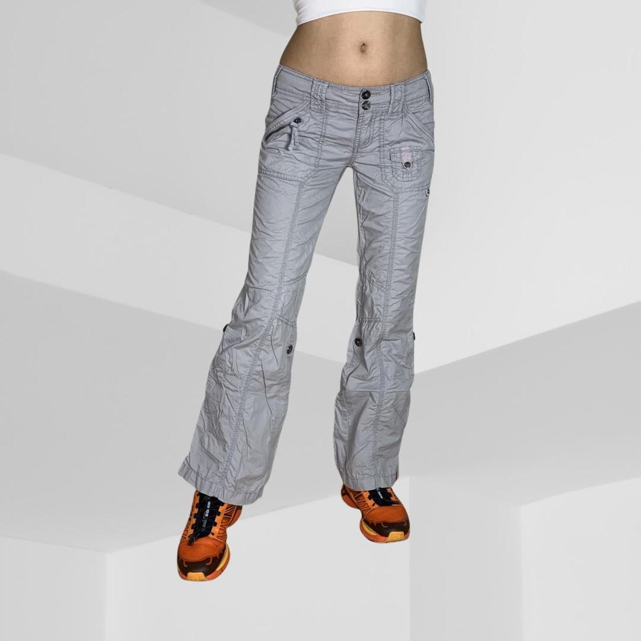 Grey cargo pants. Low rise and petite. Buttons and... Depop