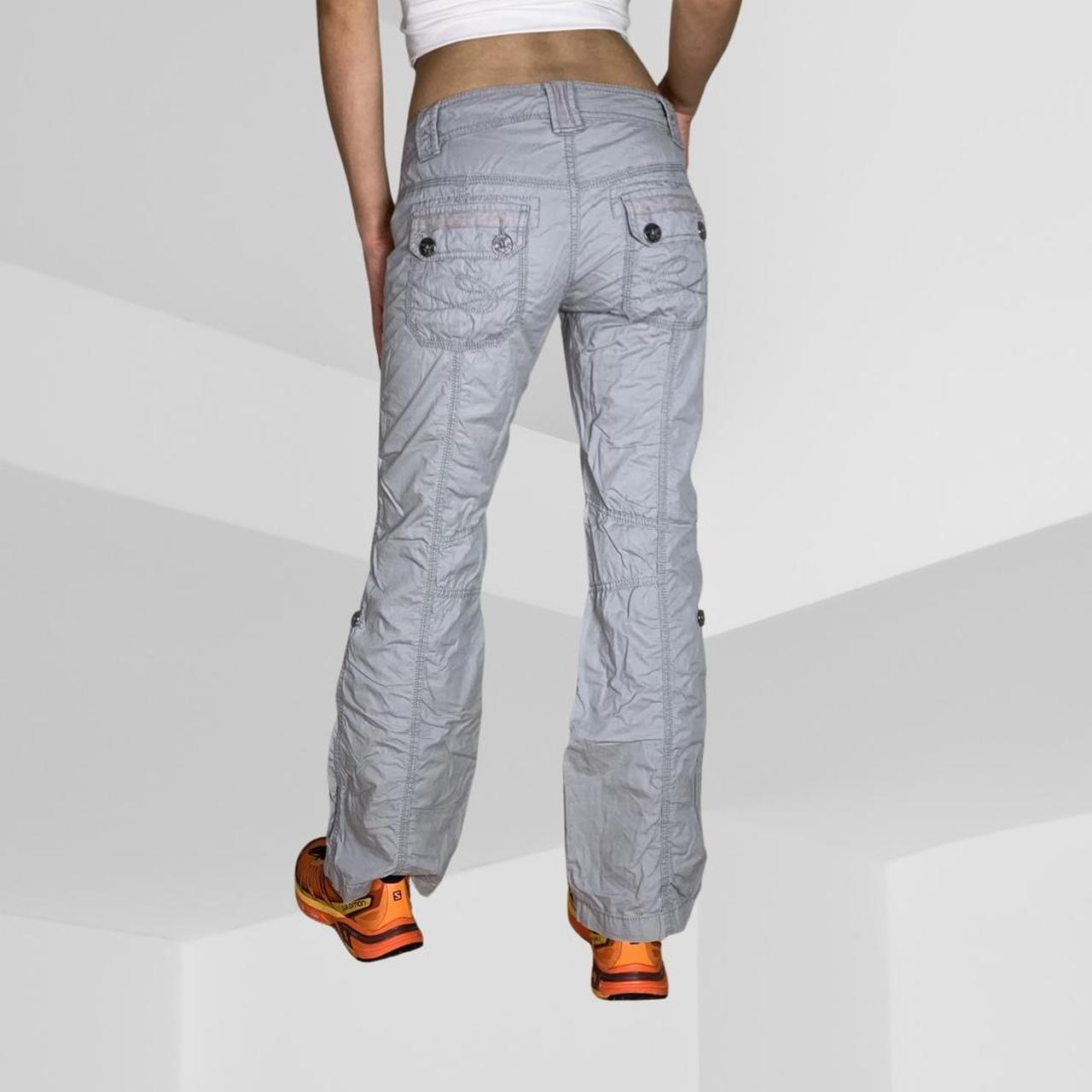 Grey cargo pants. Low rise and petite. Buttons and... Depop