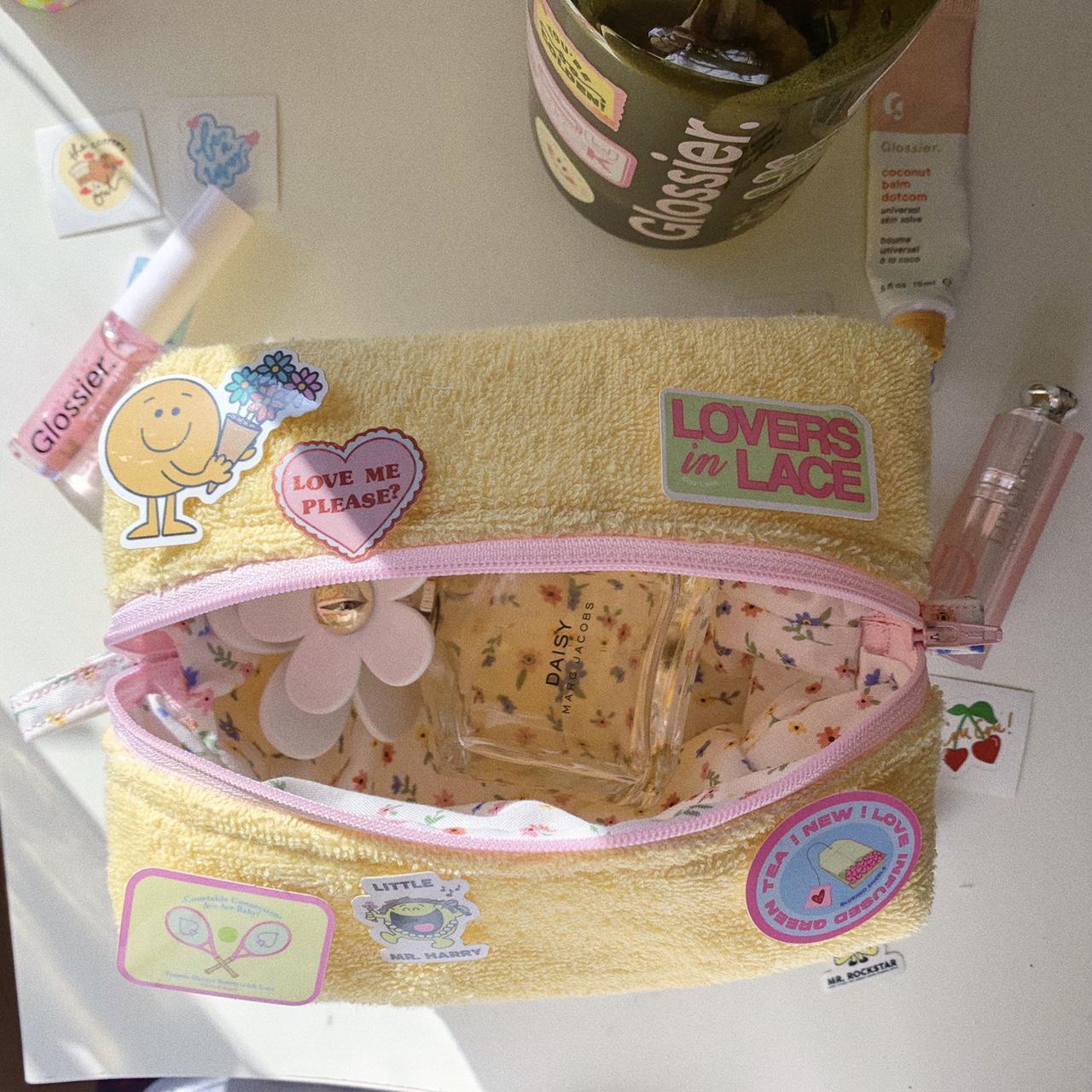 yellow terry cloth makeup bag with floral interior... Depop