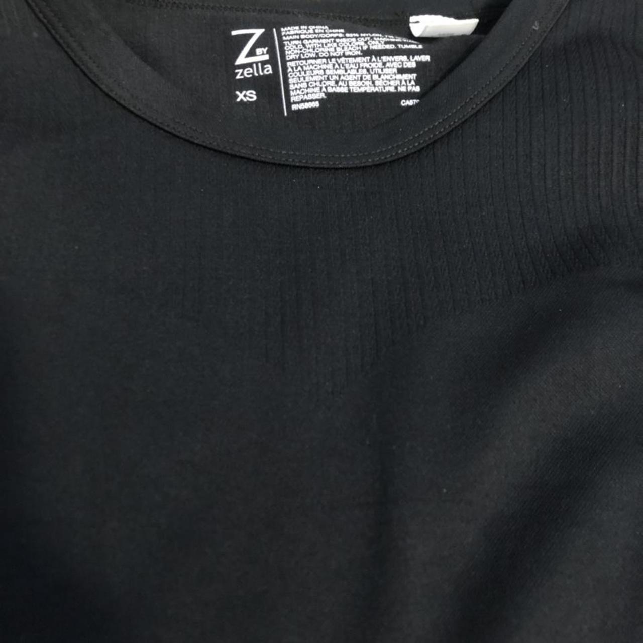 Cute tight fitting black crop shirt. Ridge detailing... - Depop