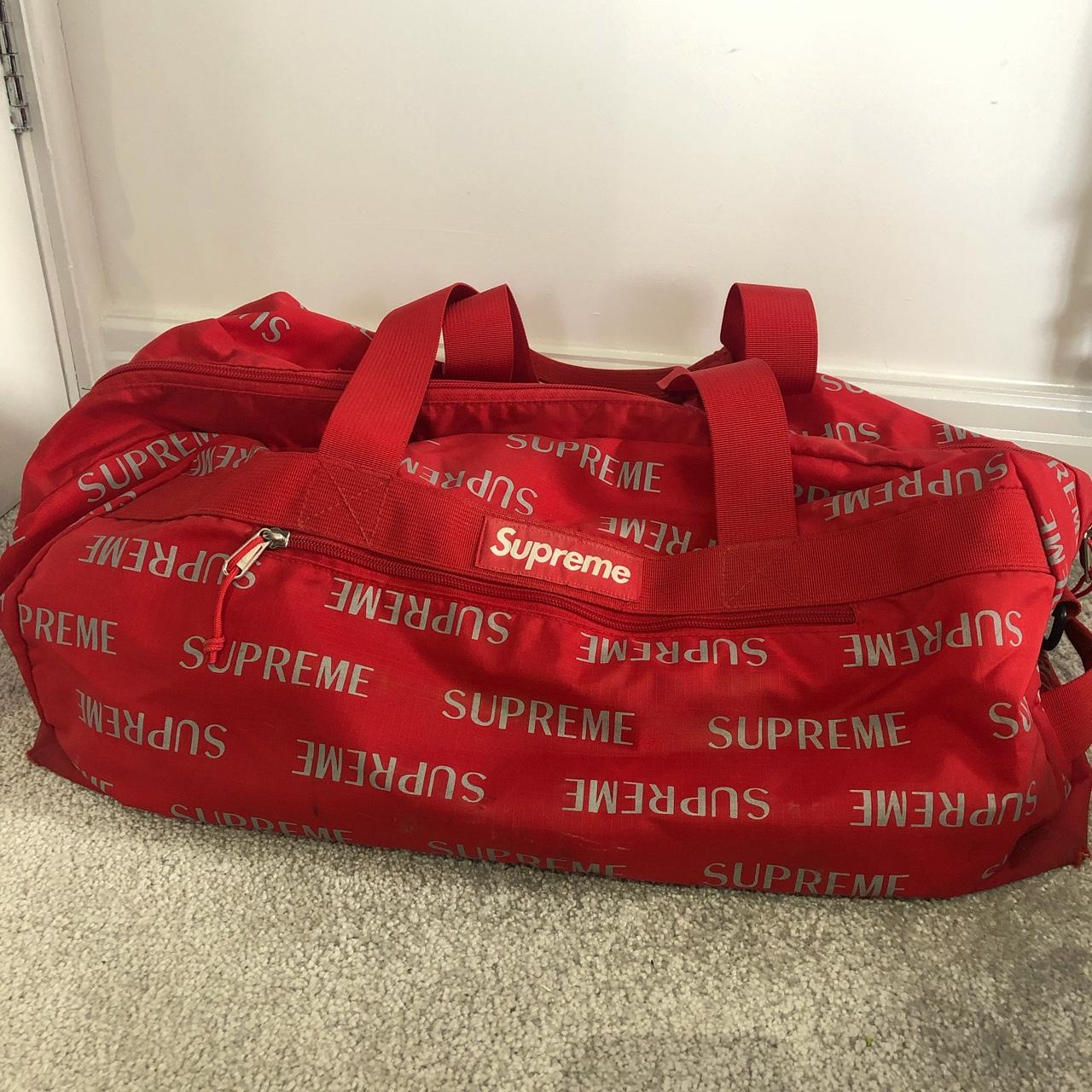 Supreme 3M Reflective Repeat Duffle Bag in red... - Depop
