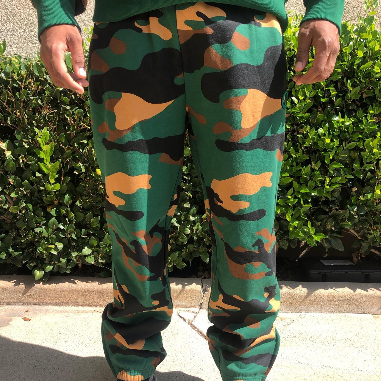 A thick pair of camouflage joggers by Champion. Depop