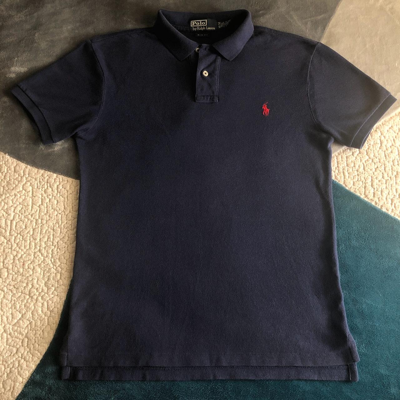 navy blue polo shirt with red horse