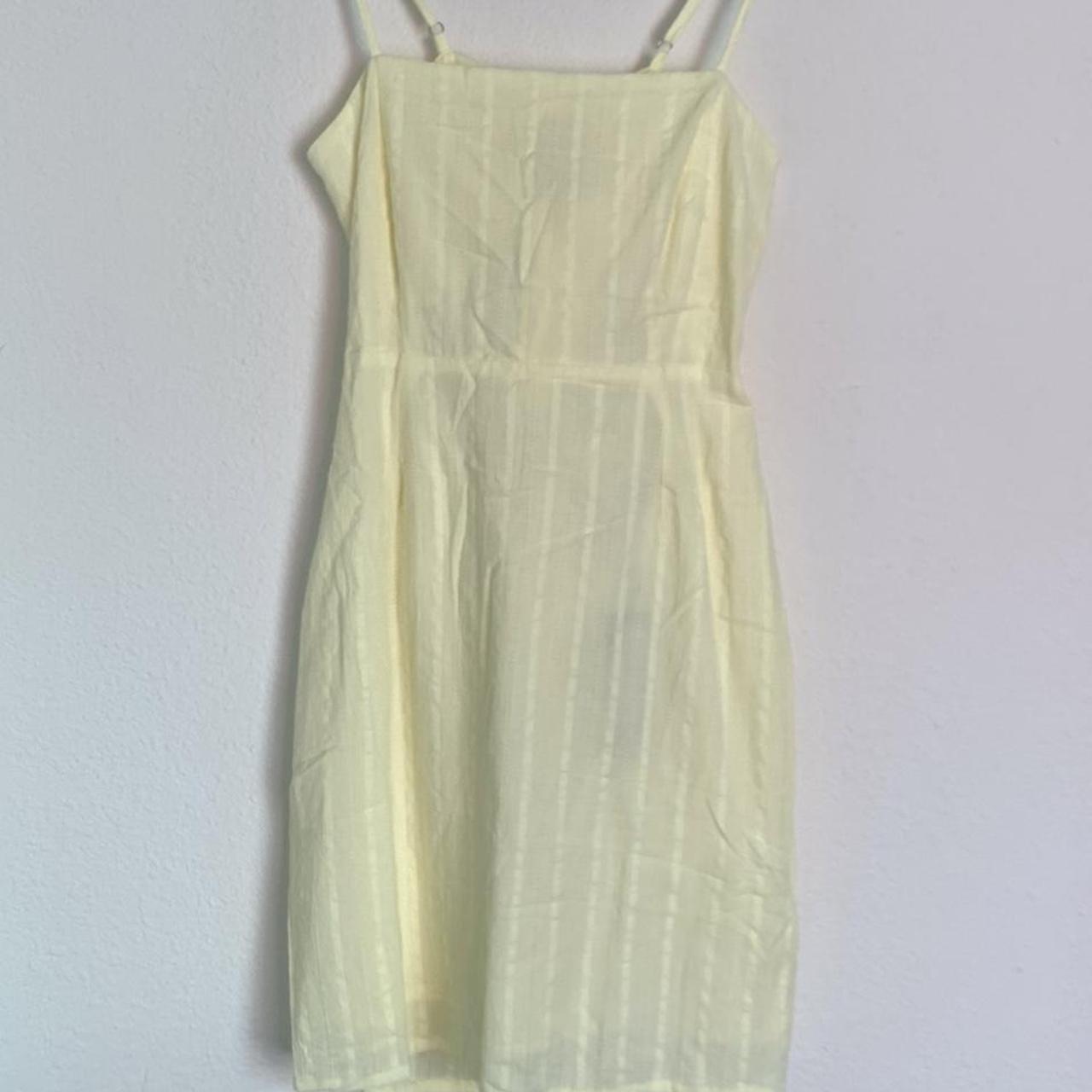 Cute yellow dress with a open back. Light weight... - Depop