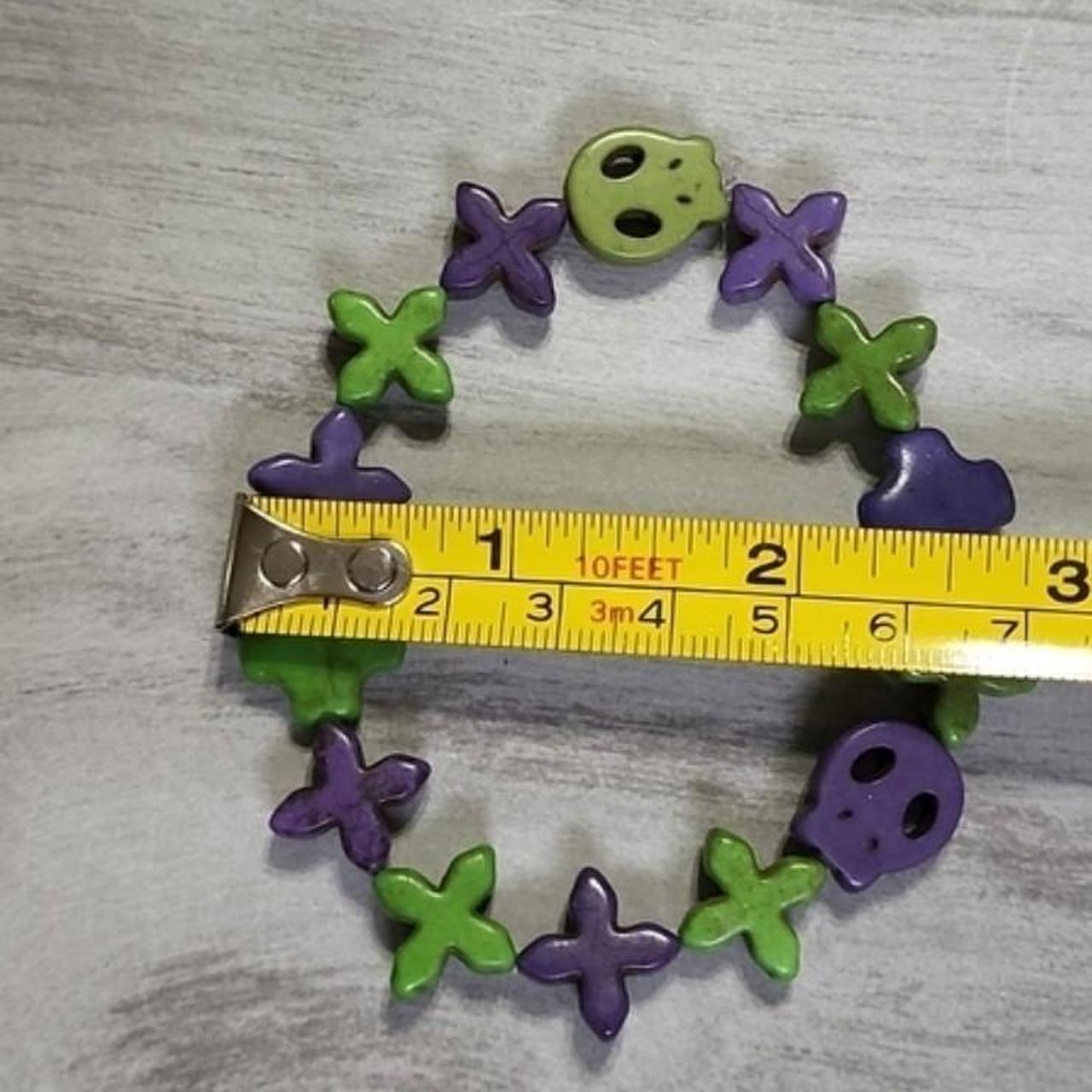 Handmade Purple and Green Skull and Cross Stretch... - Depop