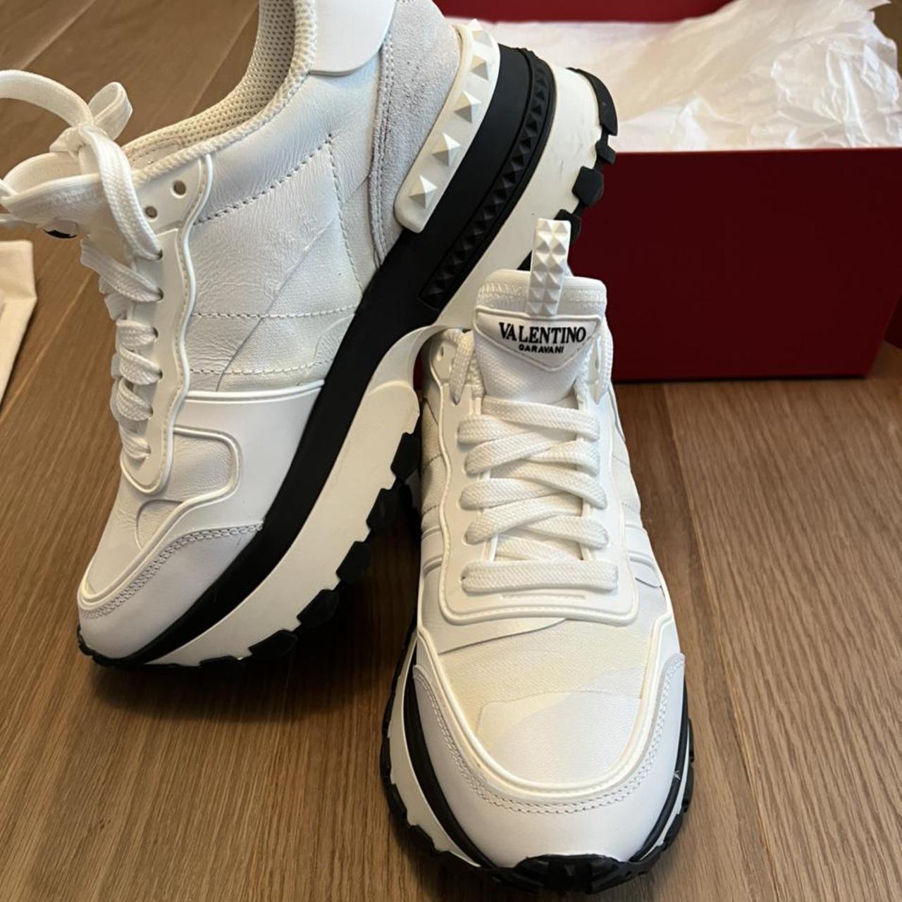 triple black valentino trainers