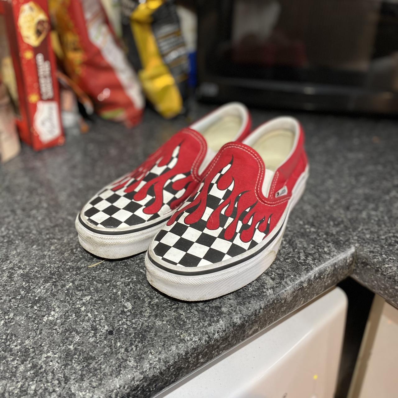 Red checkered flame slip best sale on vans