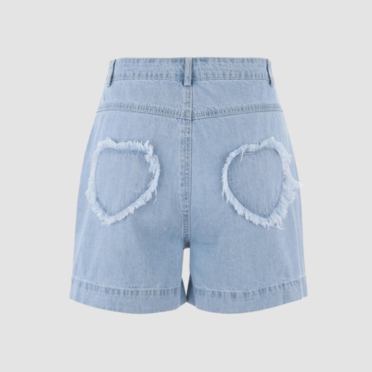 Light denim shorts with heart patches on