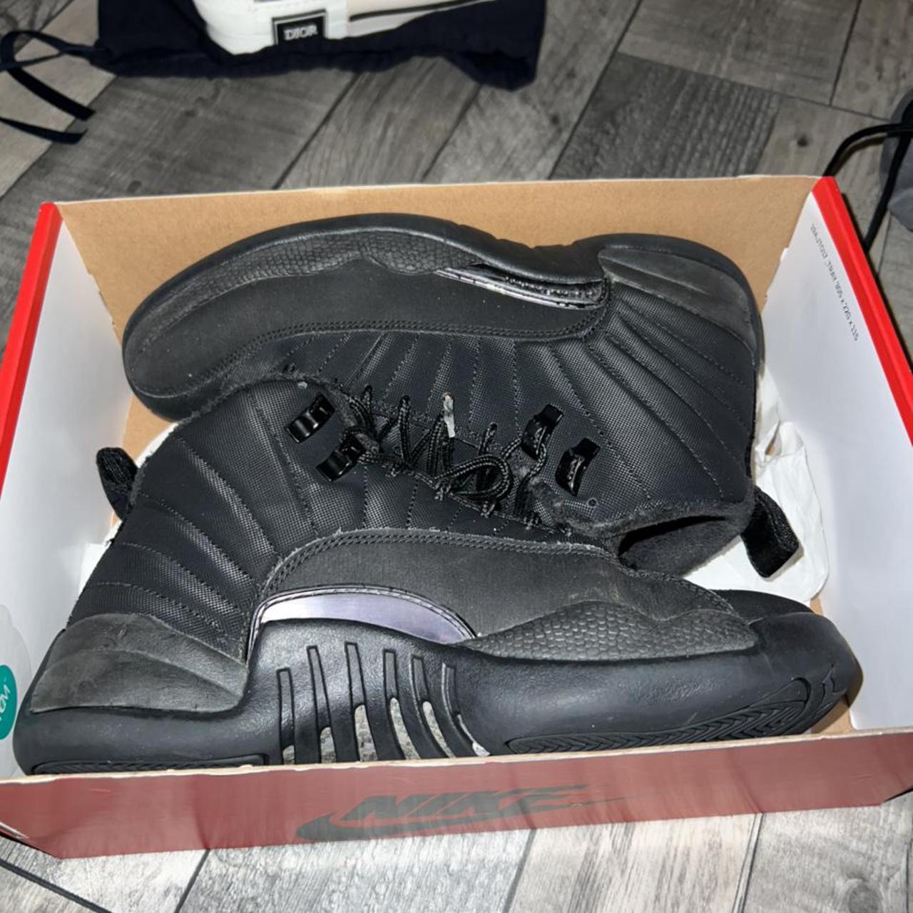 triple black jordan 12s