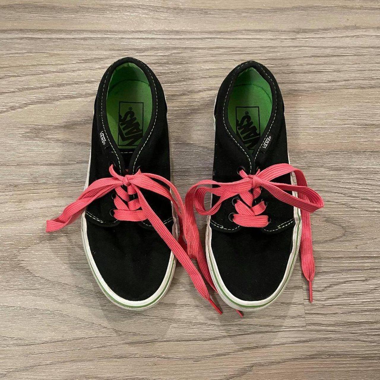 Black vans store with pink laces