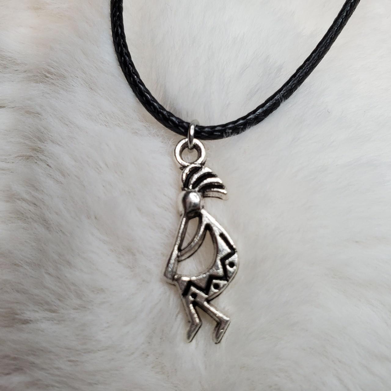 Kokopelli necklace These charms are approximately... Depop