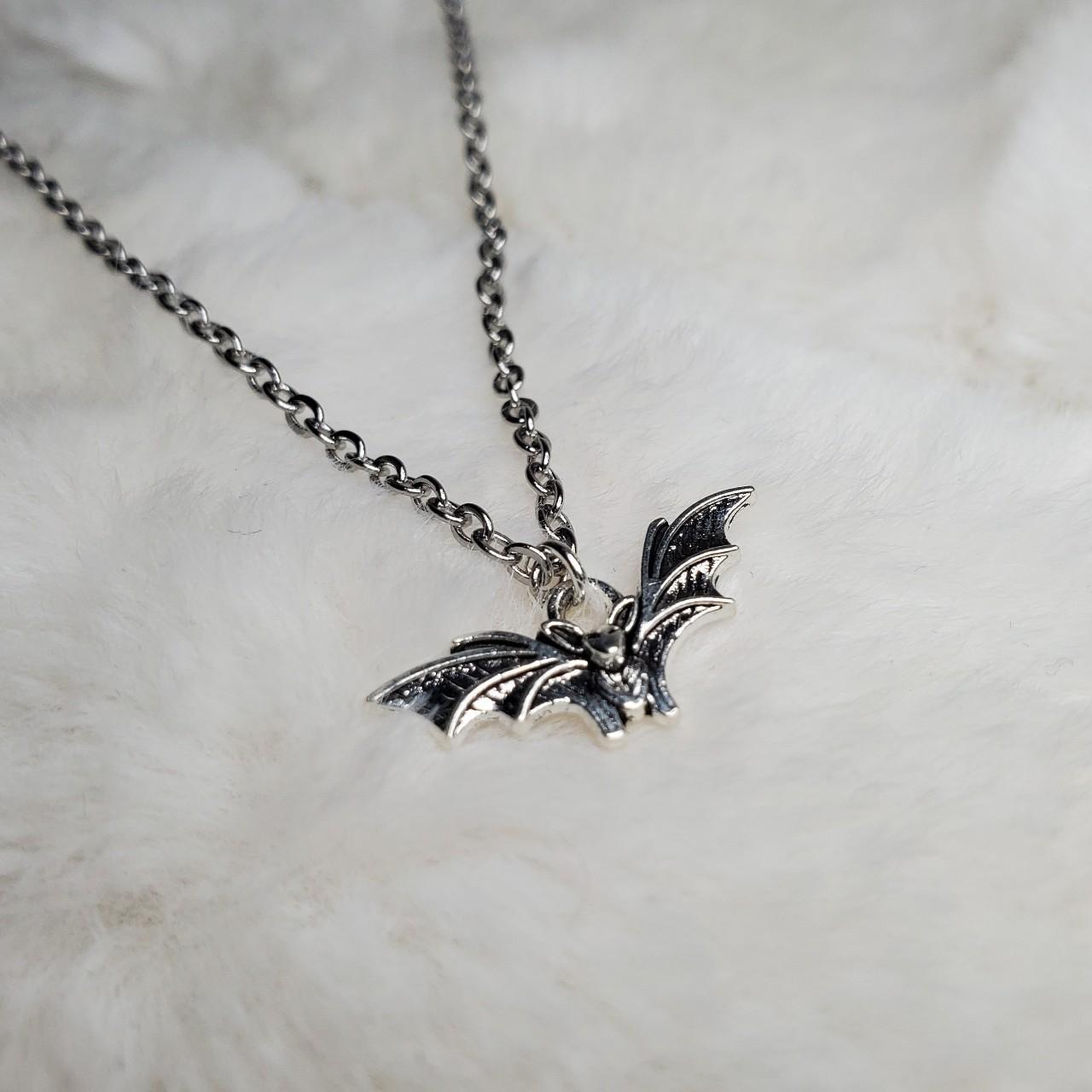 Tiny bat charm necklace. These charms are... - Depop