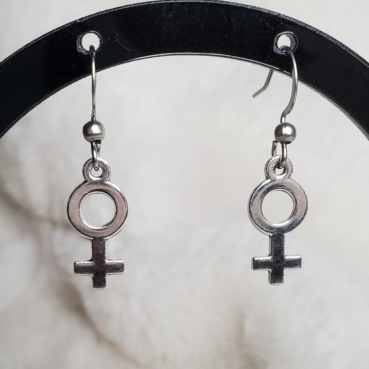 Female on sale sign earrings