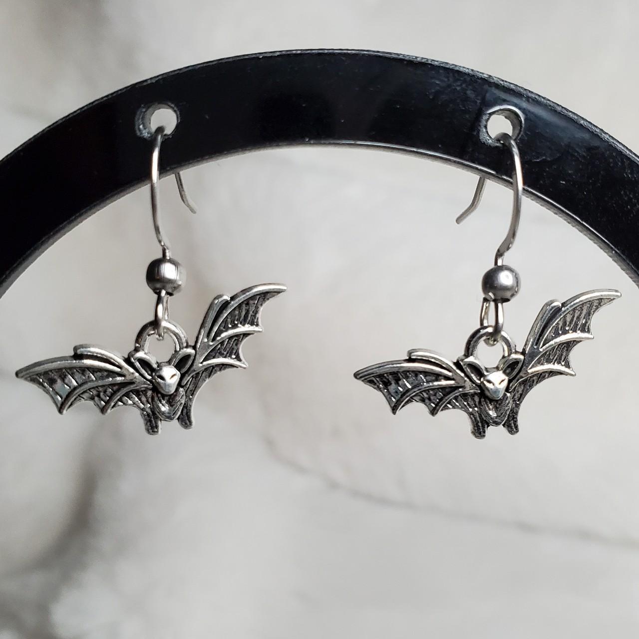 Tiny bat charm earrings. These charms are... - Depop