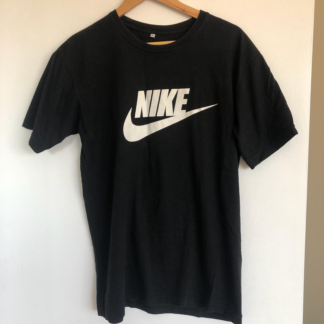 Black Nike t shirt // says XL but fits like a... - Depop