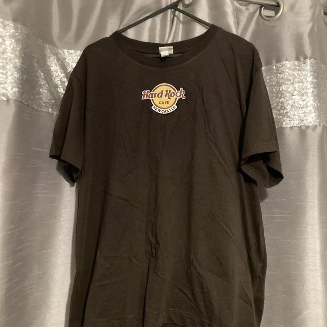 A Hard Rock Cafe Newcastle iron on patch on a brown... - Depop