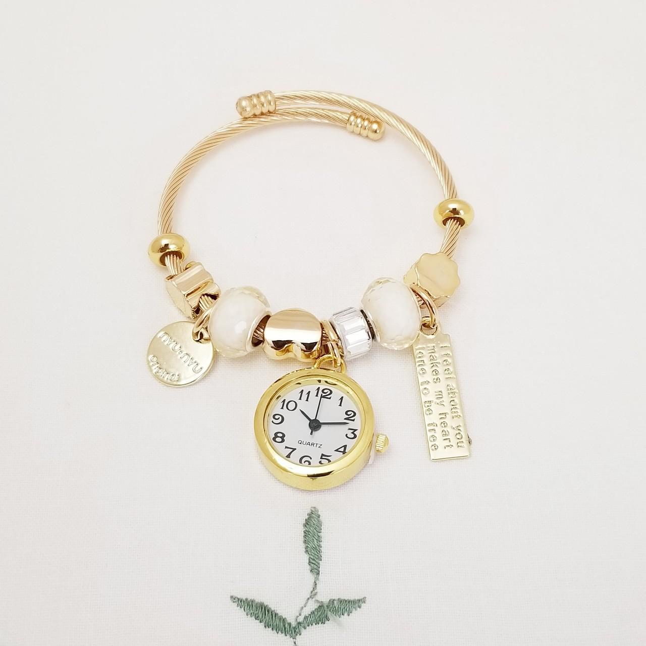 Women's White and Gold Watch (2)