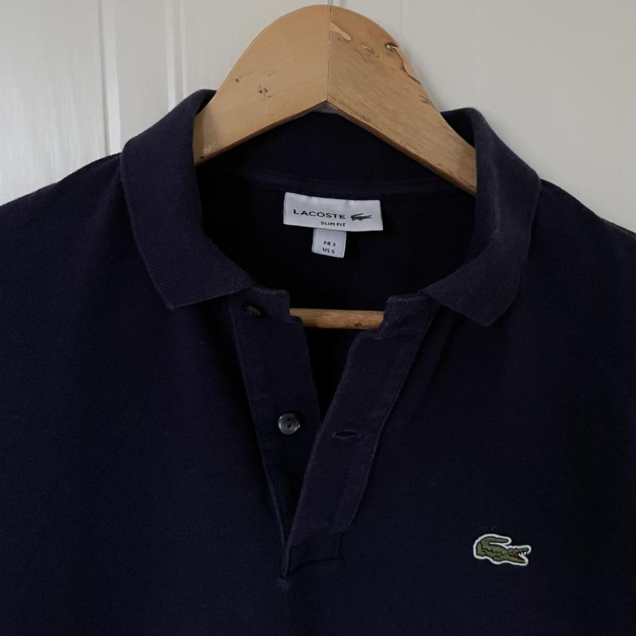 Lacoste slim fit polo shirt in navy blue, size 3... - Depop